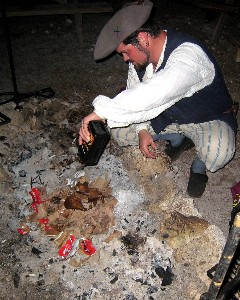 Jack Roberts using fuel to start the fire