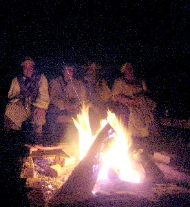 Folks keeping warm at the fire