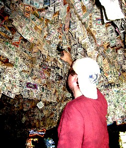 Mission stapling dollar on ceiling