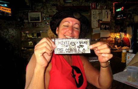 Shay holding the gussied-up dollar