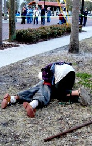 Boy crying over dead soldier