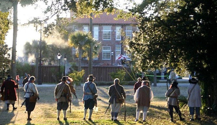 Buccanner firing line in front of a large brick building