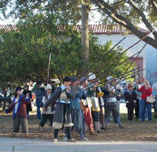 Pikesmen with their pikes at the ready on the left