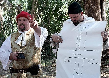 Sgt. Jeff gives the V for Victory sign, Conrad looks at the plan