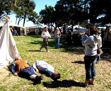 Tourist photographic sleeping re-enactor